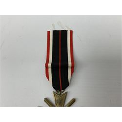 Two WW2 German War Merit Crosses, one First Class without swords, pinned and one Second Class with swords and ribbon (2)