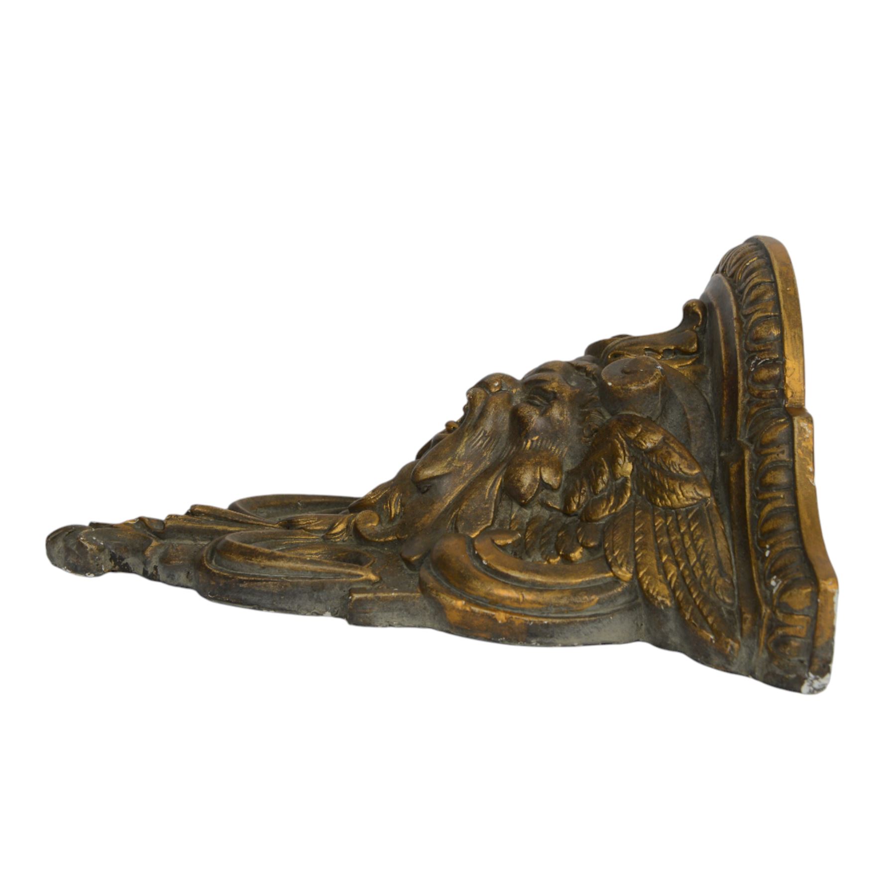 Two 20th century gilt wall brackets, comprising Rococo style carved wooden wall bracket upon a scrolling foliate support and a cast plaster bracket upon Griffin support, largest H38cm