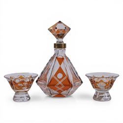 Set of four Galle, Nancy, intaglio engraved liqueur glasses, Gallé, Nancy, circa 1880, each with faceted bucket bowl engraved with animals within landscape settings, two examples engraved 'Galle Reinemer a Nancy', one engraved 'Galle a Nancy', and one unsigned, H7cm, together with a small Bohemian Art Deco amber overlaid glass decanter with stopper and two glasses, decanter H17cm