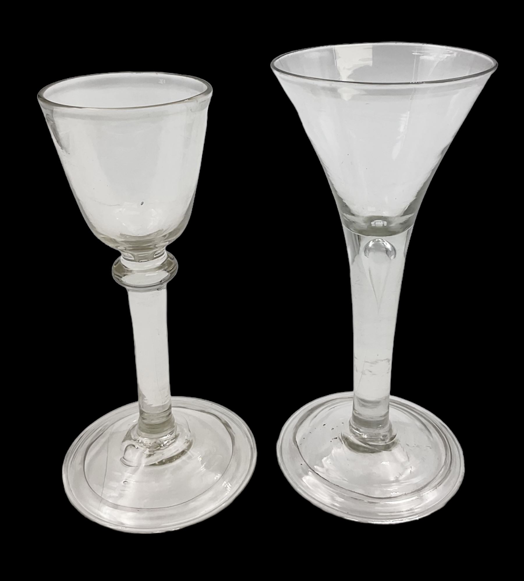 18th century wine glass, the trumpet shaped bowl upon tear drop stem and conical folded foot, H15.5cm, together with an 18th century cordial glass, the round funnel bowl on plain knopped stem and folded conical foot