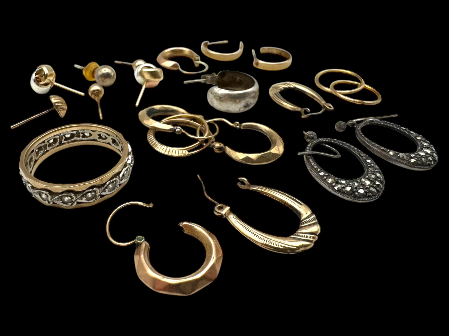 9ct gold earrings, including hoop earrings and knot earrings, together with a 9ct gold paste set eternity ring and a pair of silver marcasite earrings 