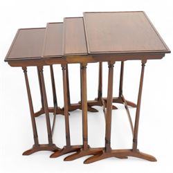 Early 20th century mahogany quartetto nest of four occasional tables, each with rectangular top with raised lip moulding, turned supports on splayed feet