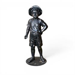 Bronzed composite figure of a boy wearing a hat, on circular plinth