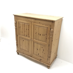 Solid pine cupboard/wardrobe, two doors enclosing single hanging rail, turned supports, W123cm H131cm, D61cm