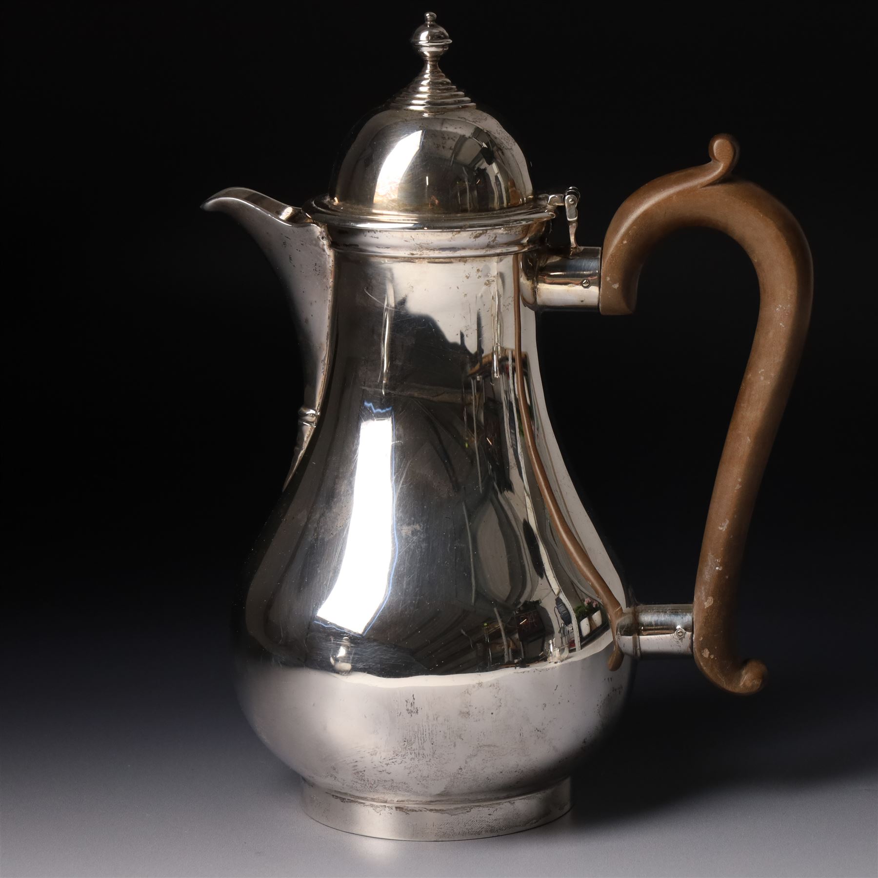 Four piece silver tea and coffee service of baluster form, the tea and coffee pots with domed covers and stained handles London 1916-1918, Maker  C S Harris & Sons Ltd