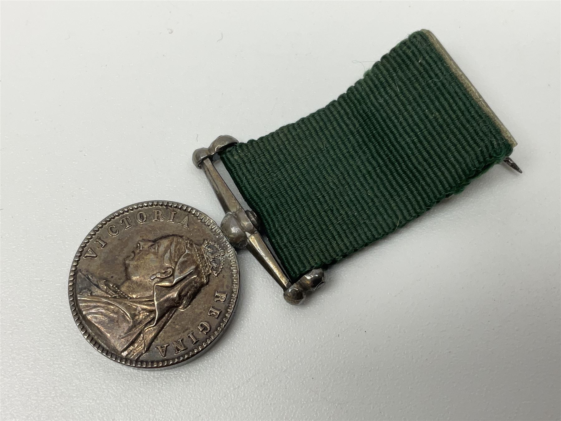 Victoria Volunteer Officers’ Decoration, V.R. cypher, hallmarked silver London 1892, with integral top riband bar and ribbon, unnamed; the matching miniature; and Victoria 'For Long Service in the Volunteer Force' miniature medal with ribbon in original case (3)