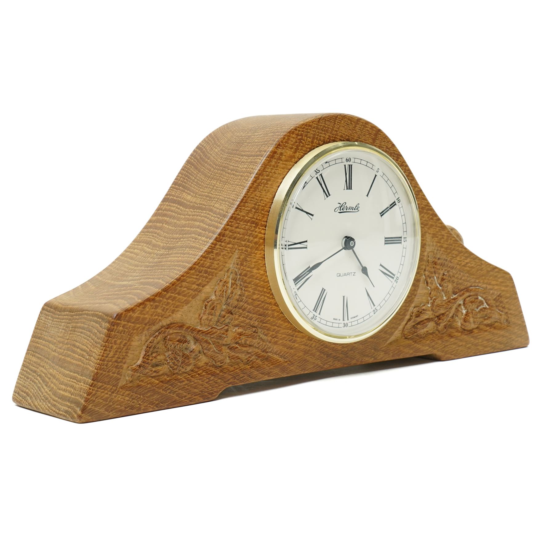 Beaverman - oak arched top mantel clock, with acorn and oak leaf carvings to spandrels, fitted with Hermle Quartz movement with Roman dial, with carved beaver signature, by Colin Almack of Sutton near Thirsk
