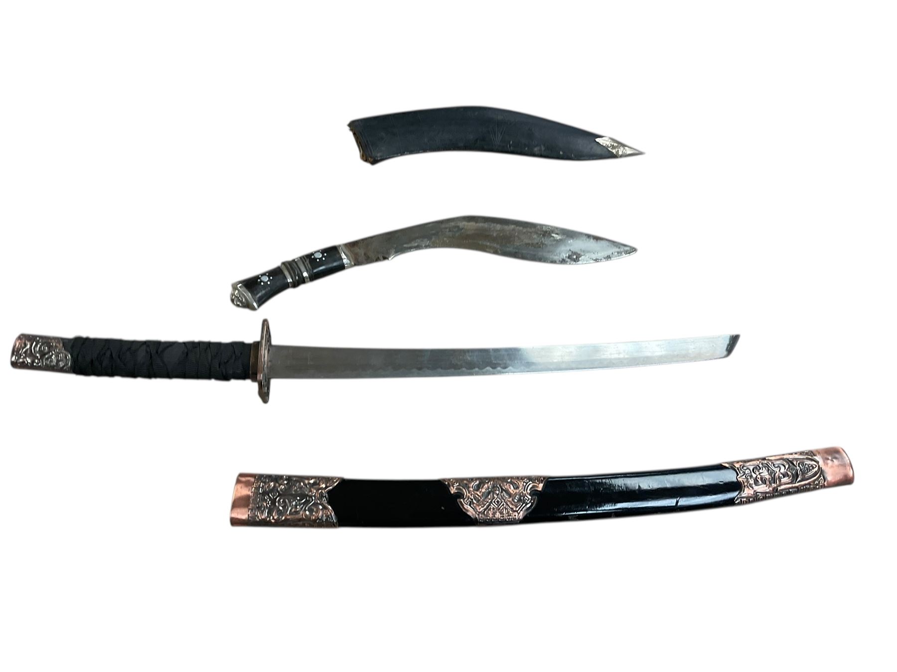 Eastern Kukri knife in leather scabbards, together with a reproduction sabre, in a lacquered scabbard with copper detail, Kukri L40cm  