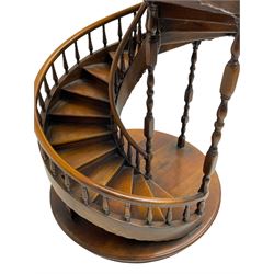 Miniature fruitwood spiral staircase, turned newel posts and balusters, rounded handrail, on circular moulded base
