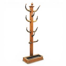 19th century cattle horn coat stand, comprising ten cattle horns for use as hooks and an u...