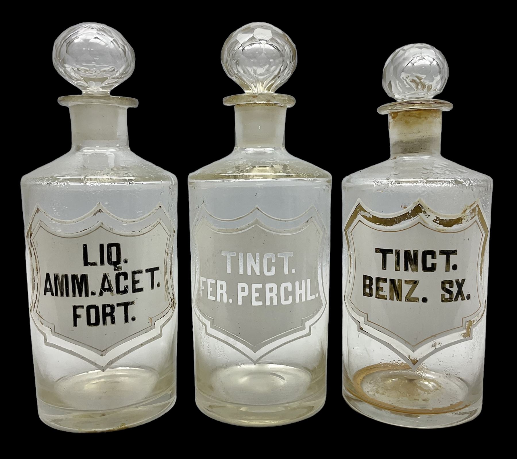 Three Victorian apothecary chemist bottles complete with labels and glass stoppers, H22cm