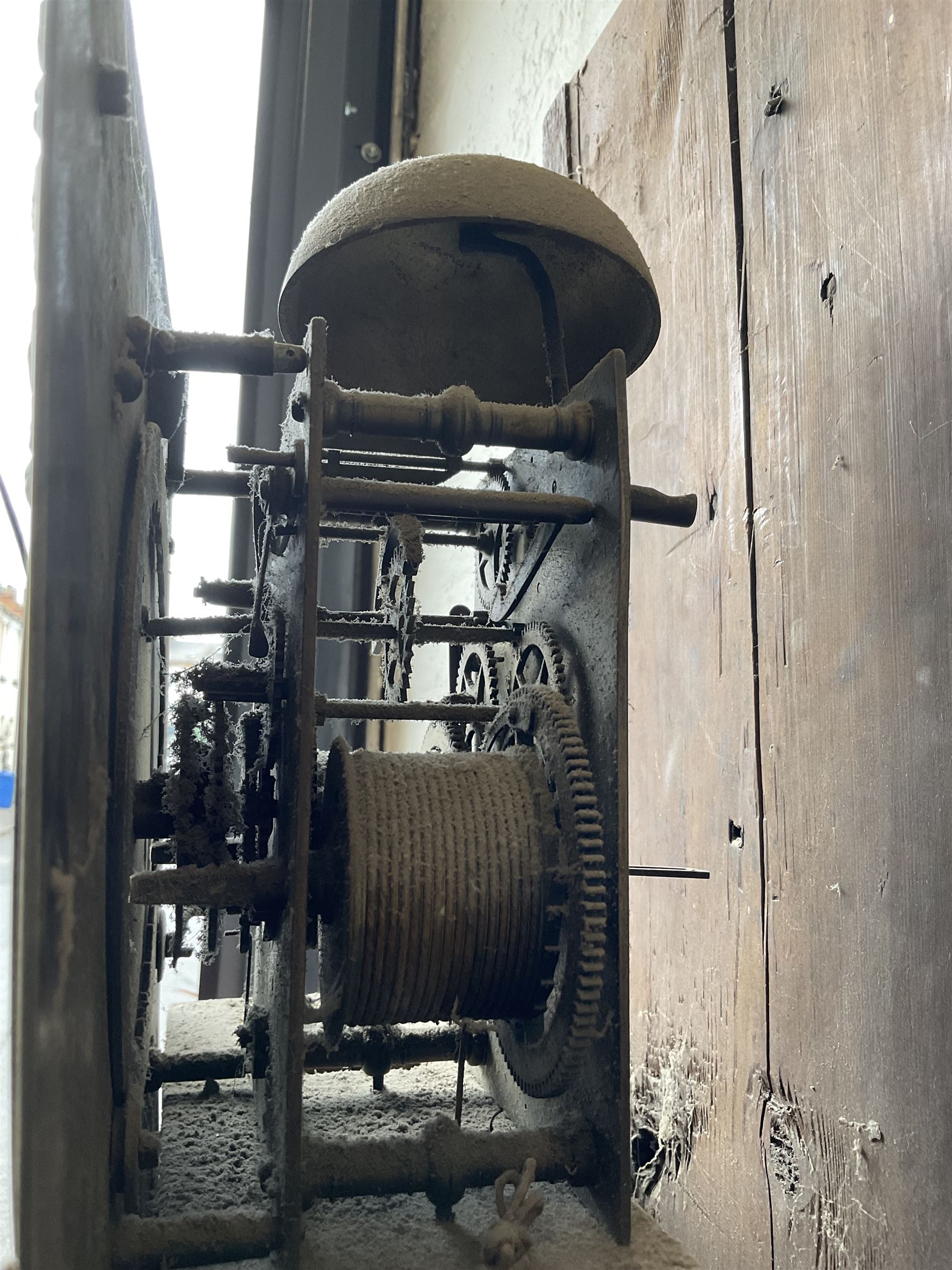 Robert Henderson of Scarborough -mid-18th century eight-day longcase clock c1750, with a flat topped pediment and broad cornice, carved frieze beneath and a square hood door flanked by detached pilasters with gesso capitals, profusely carved trunk with a break arch topped door on a square plinth raised on a shaped base, brass dial with a matted and engraved dial centre, cast spandrels and chapter with Roman numerals and five minute Arabic's, with a seconds dial and date aperture, dial pined directly to a rack striking movement with a recoil anchor escapement, sounding the hours on a bell. With weights and pendulum.
Robert Henderson was one of the first clockmaker recorded as working in Scarborough, b1678-d1756.

