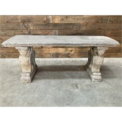 Cast stone garden Rams Head bench, two pillars set with architectural rams heads, rectangular slab seat