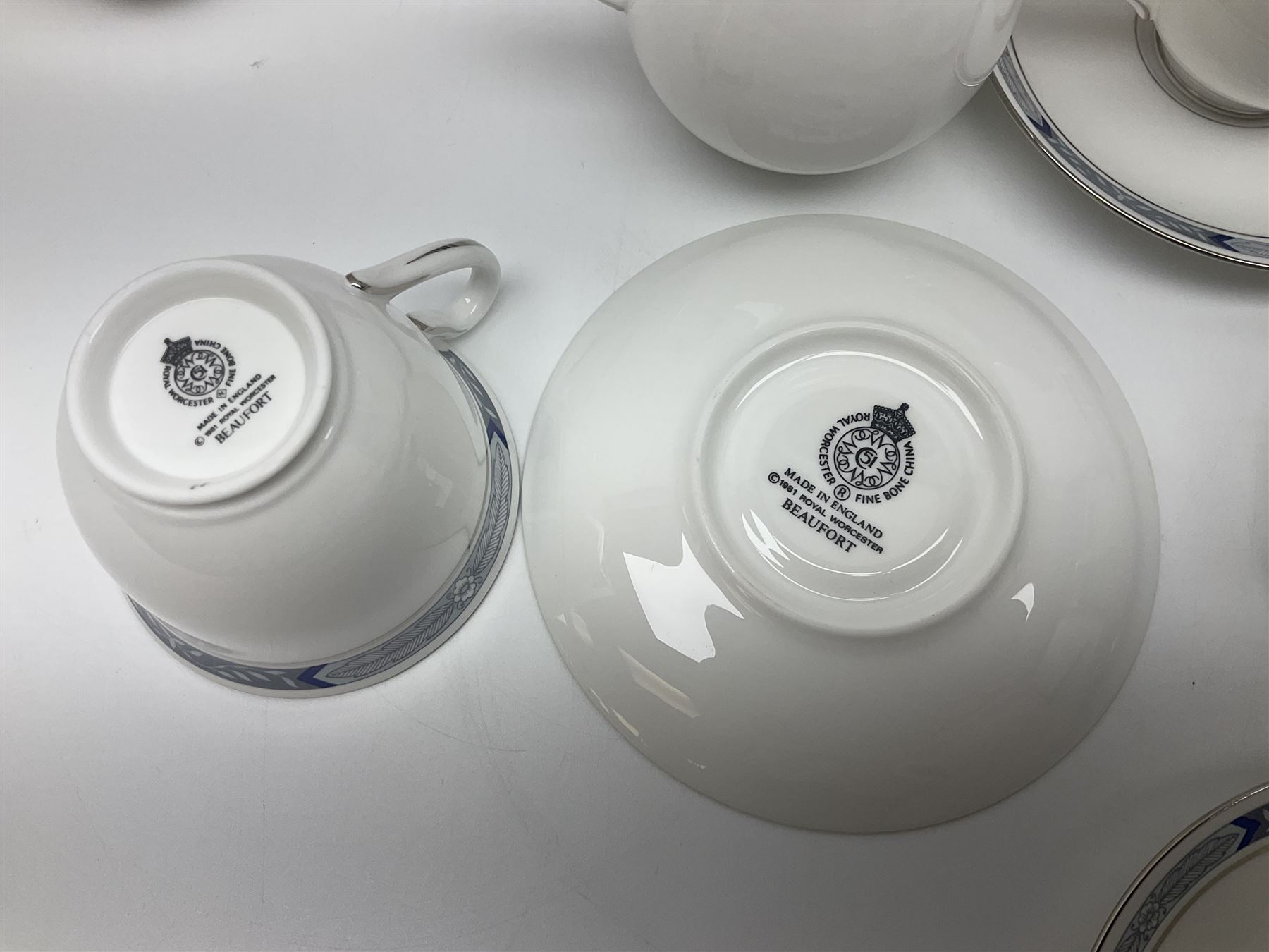 Royal Worcester Beaufort tea service, comprising teapot, milk jug, open saucier, eleven teacups, twelve saucers, eight dessert plates and one cake plate