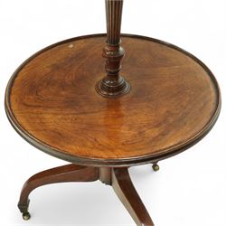 Regency mahogany dumb waiter, with two graduated circular tiers raised on a turned column and tripod base terminating in brass castors, circa 1820