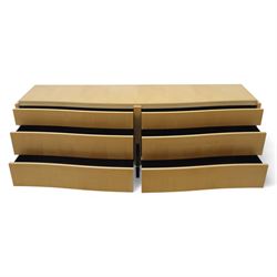 Contemporary maple veneered sideboard, serpentine glass top over six graduating Blum soft-close drawers, raised on curved black and gilt accented supports