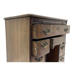 Georgian walnut kneehole desk, moulded rectangular top with book-matched veneers within crossbanding, fitted with slide over one long drawer, frieze drawer, six small drawers and recessed cupboard, raised on bracket feet