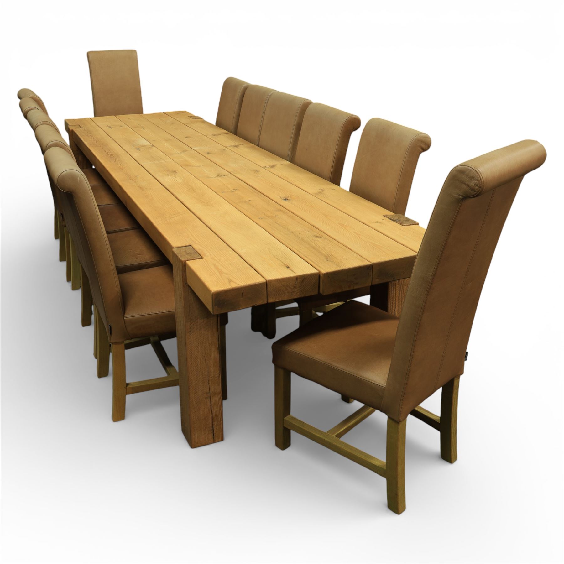 Modern large oak plank top dining table and twelve brown leather high back chairs, table of rustic construction five solid planks with exposed supports, the chairs in brown leather hide with ten standard height and a pair of taller chairs for the foot and head of the table