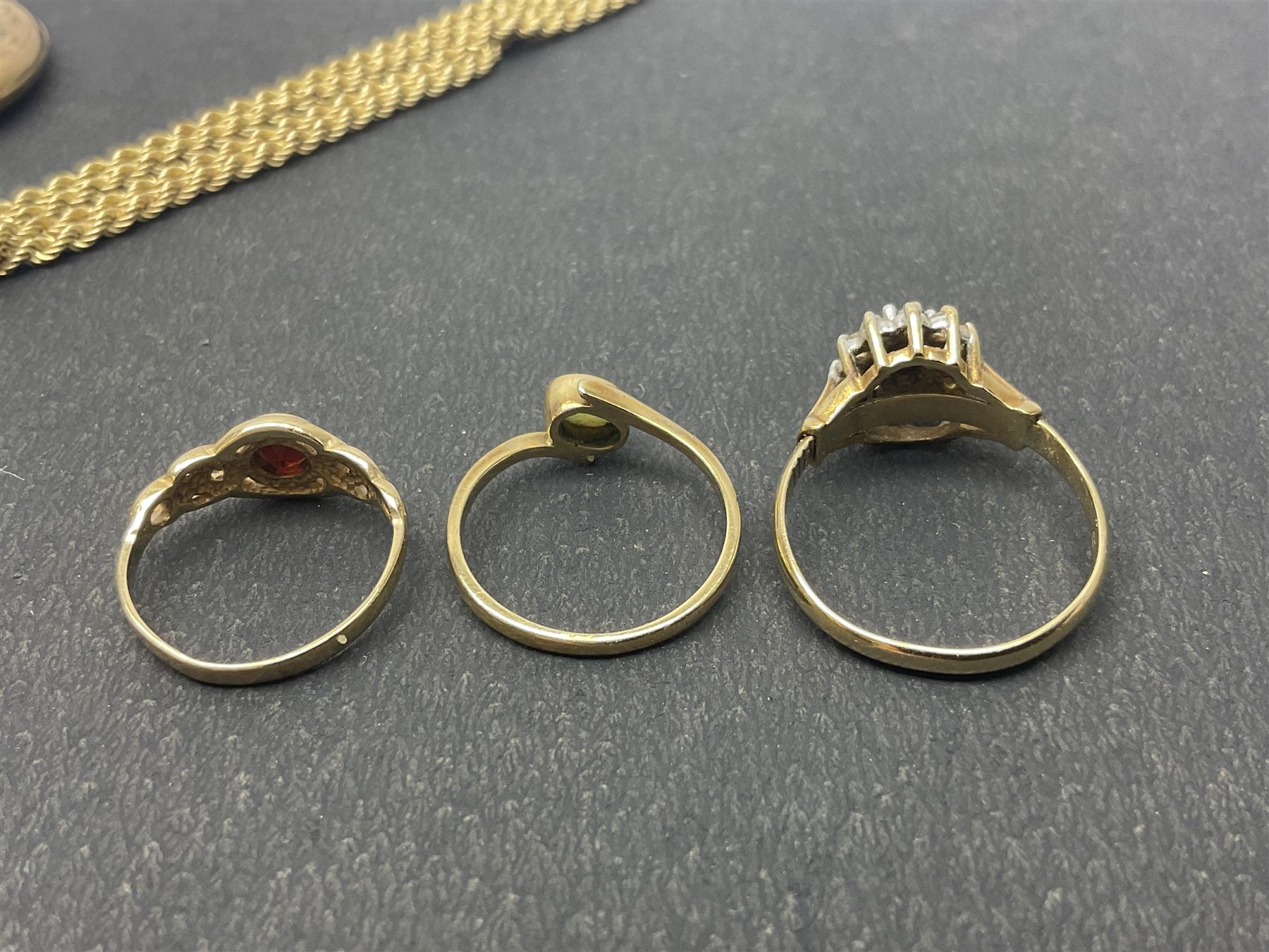 9ct gold jewellery, including opal ring and two other stone set rings, locket and rope twist chain 