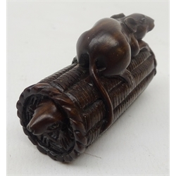  Japanese Meiji boxwood Netsuke carved as a rat perched on top of a rice bail and another rat below, inset with glass eyes, carved with signature in mother-of-pearl cartouche, L5.5cm Provenance: private collection   