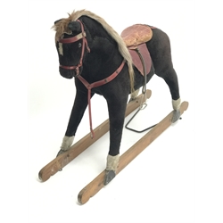  Early 20th century plush covered rocking horse, saddle and stirrups, no trestle base, L135cm  