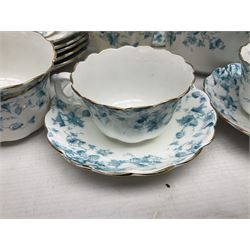 Edwardian David Chapman & Sons tea service for six, of lobed form decorated with blue transfer printed foliate decoration and gilt rims