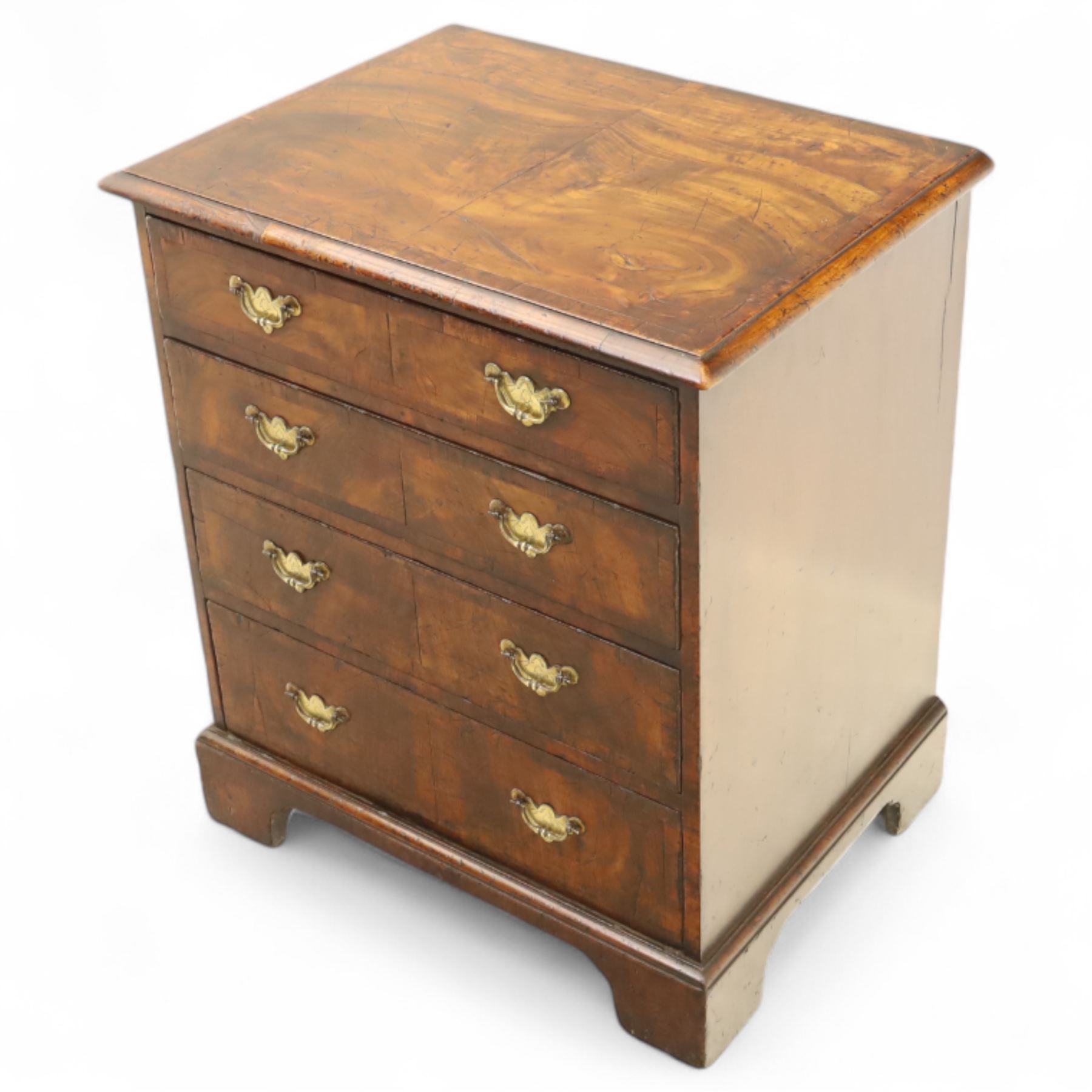 Small 19th century figured walnut chest of drawers, rectangular top with moulded edge over four graduating drawers with brass batwing handles, raised on bracket feet