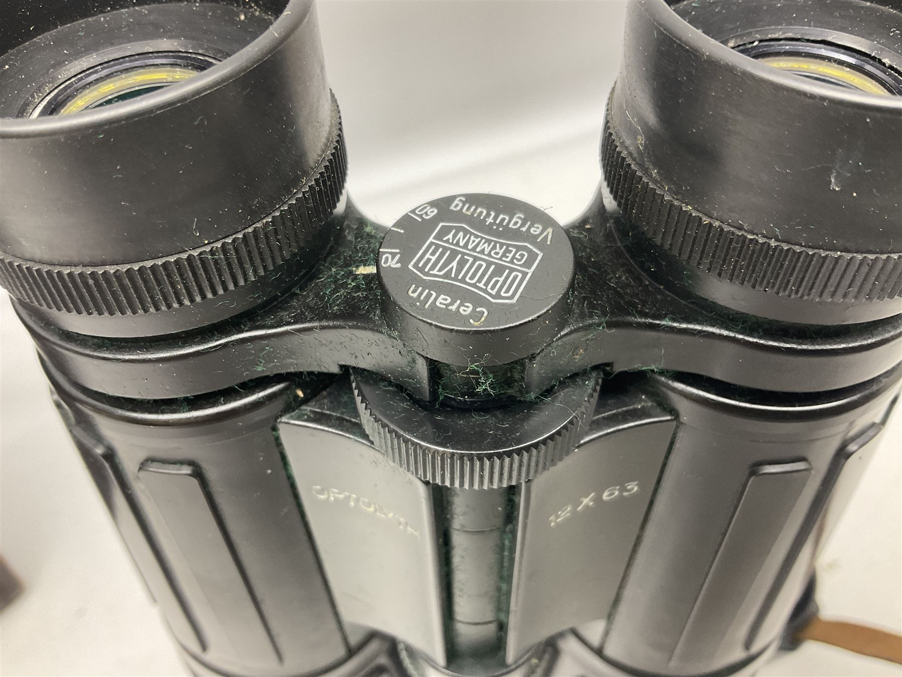 Pair of Optolyth 12 x 63 binoculars, made in Germany, serial no 82186, in leather case
