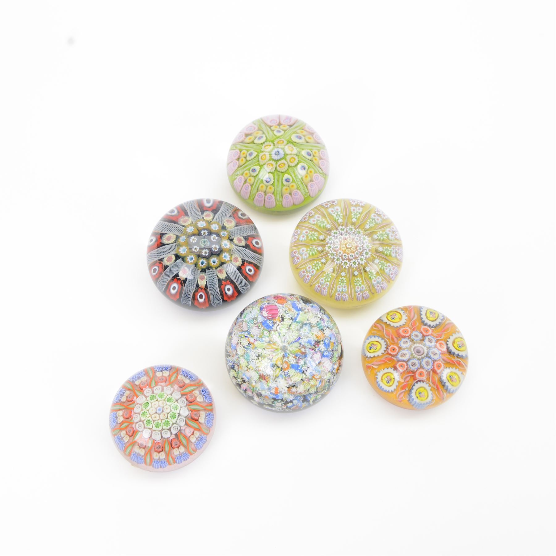 Six millefiori paperweights, including Perthshire paperweight of balubas form the millefiori canes in the form of a flower
