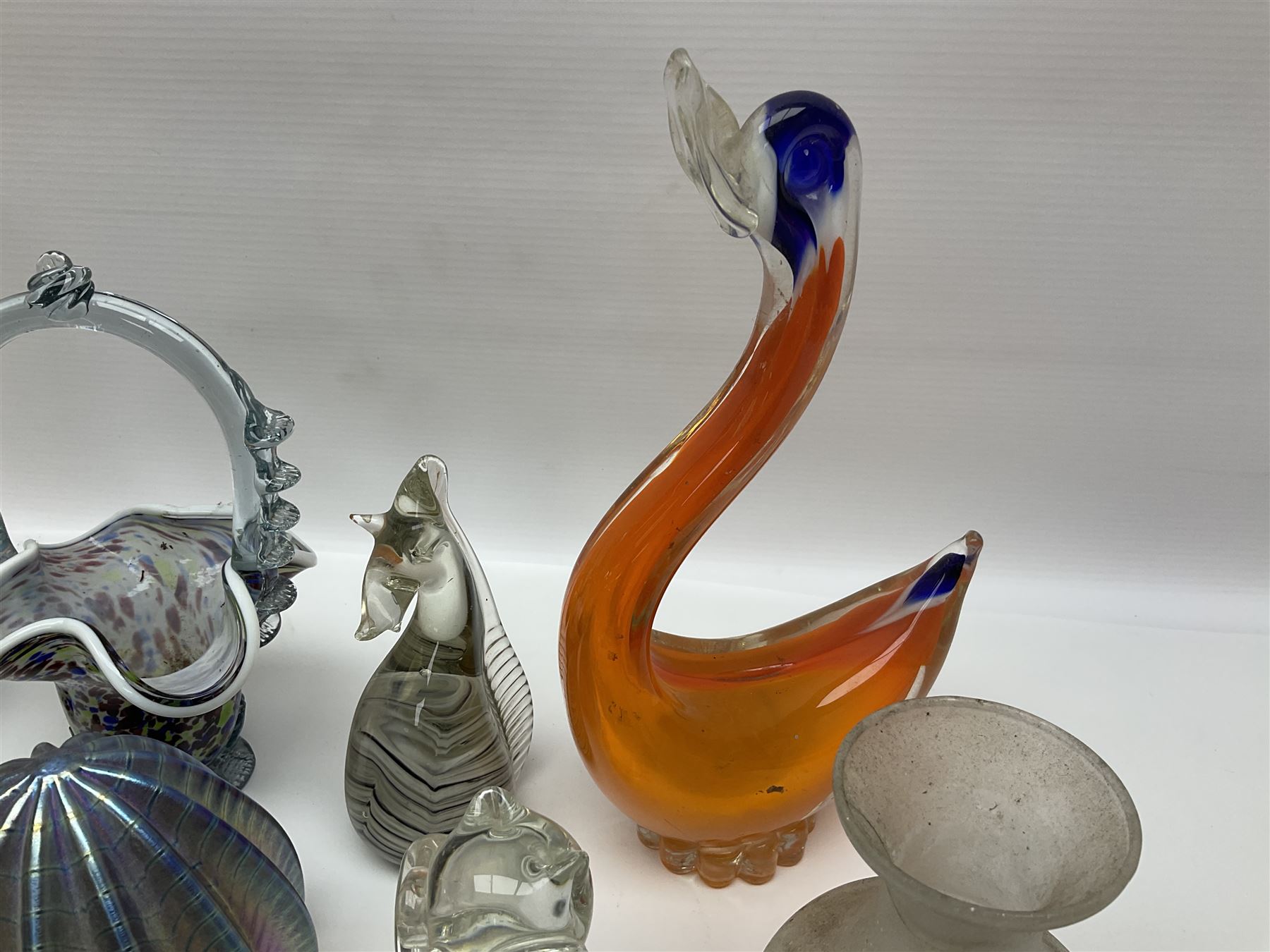 Robert Held iridescent art glass sea urchin paperweight, signed to underside, together with Murano glass clown and a collection of other glass paperweights and animals, etc 