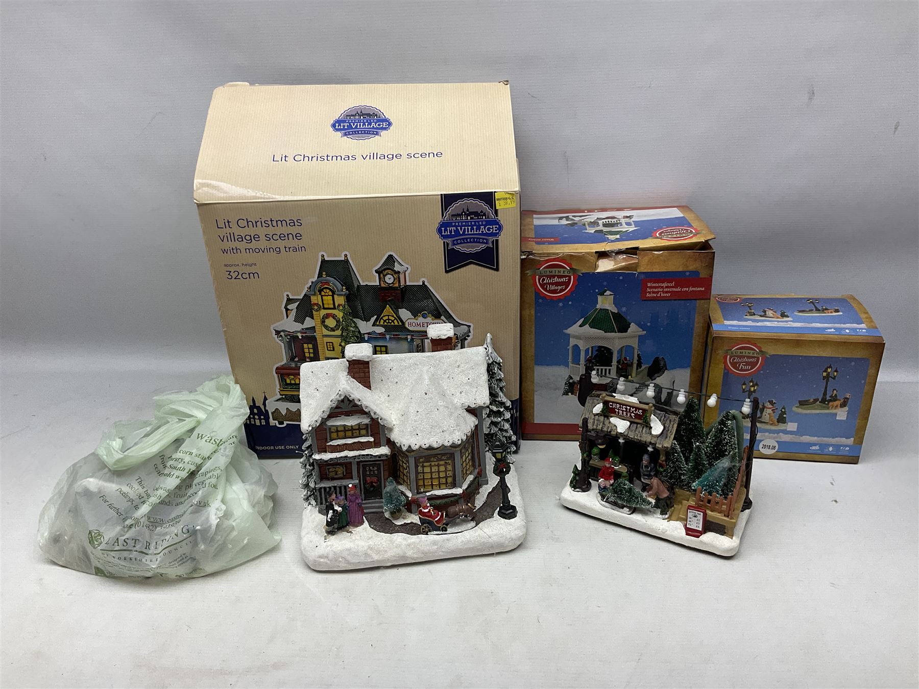 Christmas decorations; Premier LED Christmas Village scene with moving train, together with three Lumineo christmas scenes, and other similar 