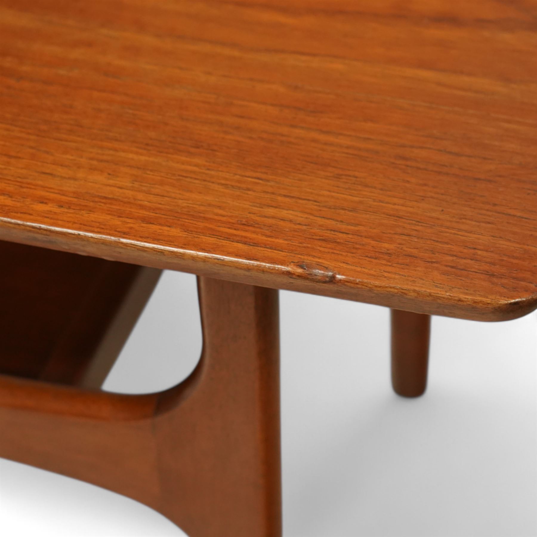 Jentique - Mid-century 'Stingray' teak coffee table, rectangular form with rounded corners, raised on shaped supports united by a magazine under tier 