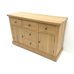 Light oak sideboard, five drawers, two cupboards, plinth base, W143cm, H91cm, D48cm