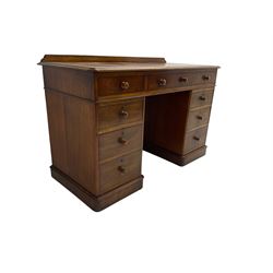 Victorian mahogany twin pedestal desk, rectangular top with raised back, fitted with nine drawers on plinth bases