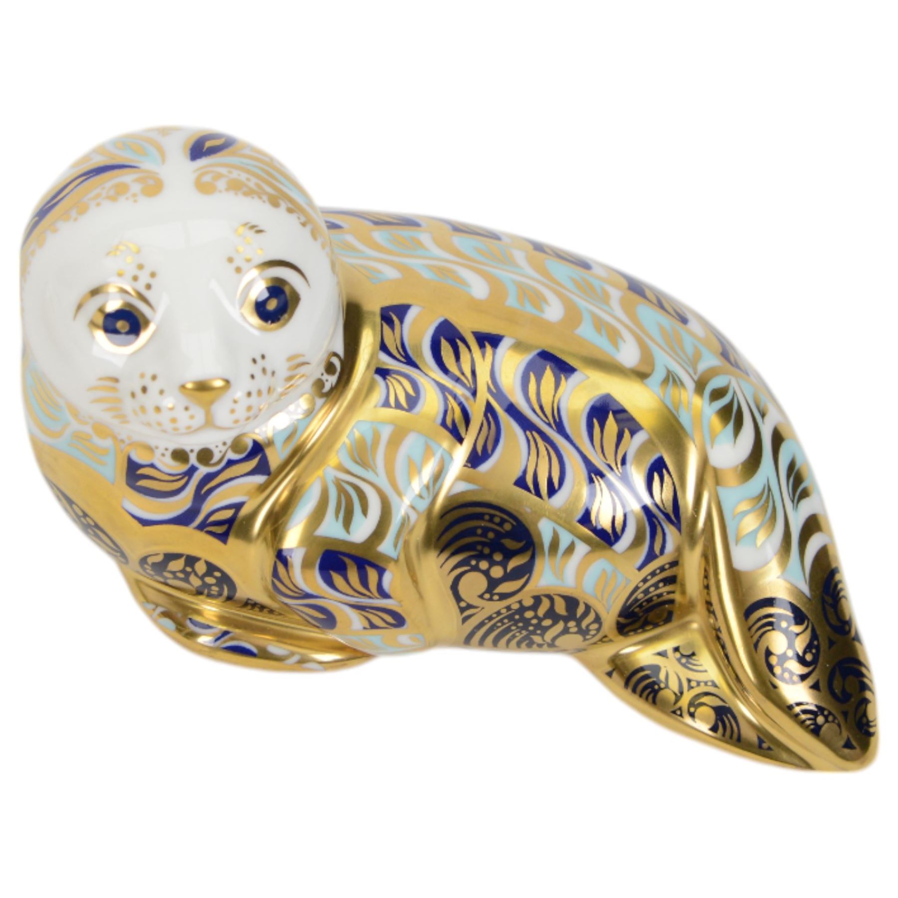 Three Royal Crown Derby paperweights, comprising Cromer Crab, Harbour Seal and Seahorse, all with gold stoppers and boxes