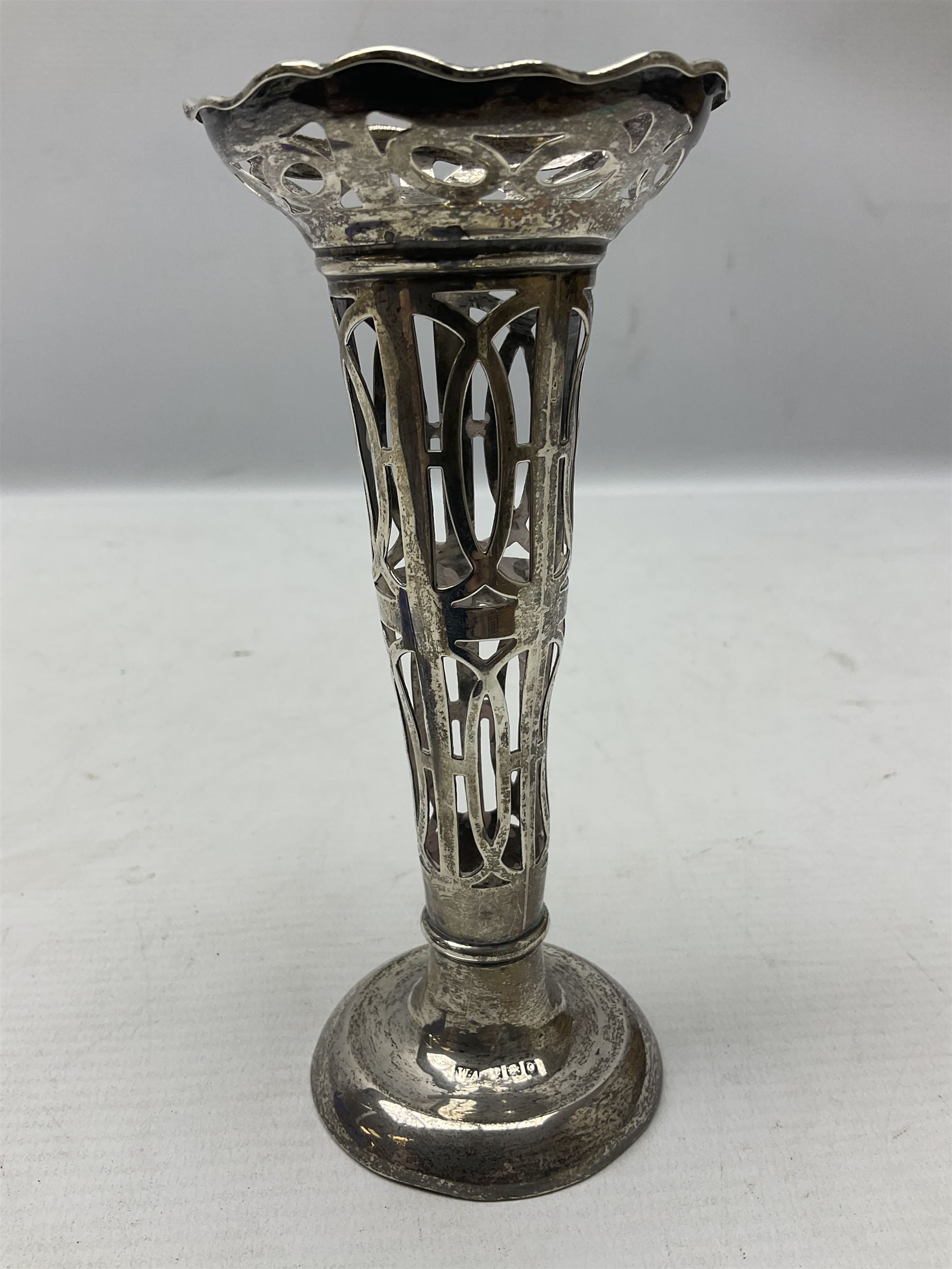 20th century silver specimen vase, of pierced trumpet form with flared rim, filled base, and blue glass liner, hallmarked Birmingham 