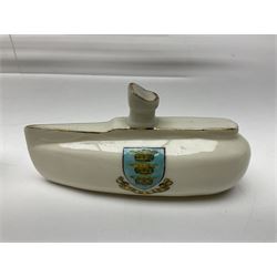 Ten WW1 crested china military models comprising submarine, four ships including Lusitania, four Zeppelins/balloons and an aircraft; various makers including Arcadian China, Swan China, Carlton China, Waterfall, Grafton China etc; various crests including Saint Neots, Great Yarmouth, Tewksbury, Swanage, Simons Town, Hull etc (10)