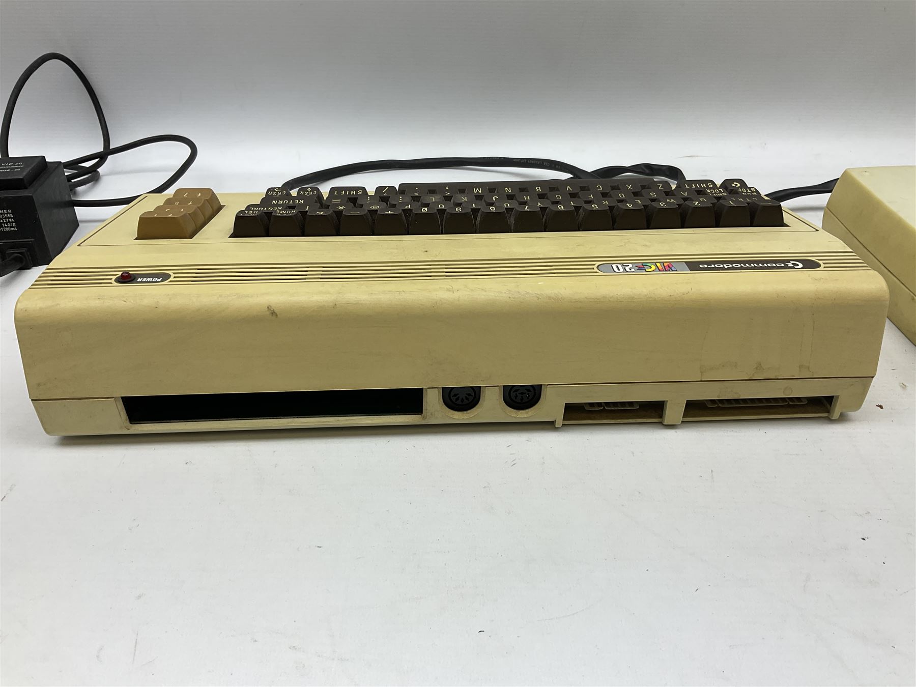 Commodore Vic 20 colour computer with power supply together with Commodore Datassette and Super Lander VIC 1907 game cassette