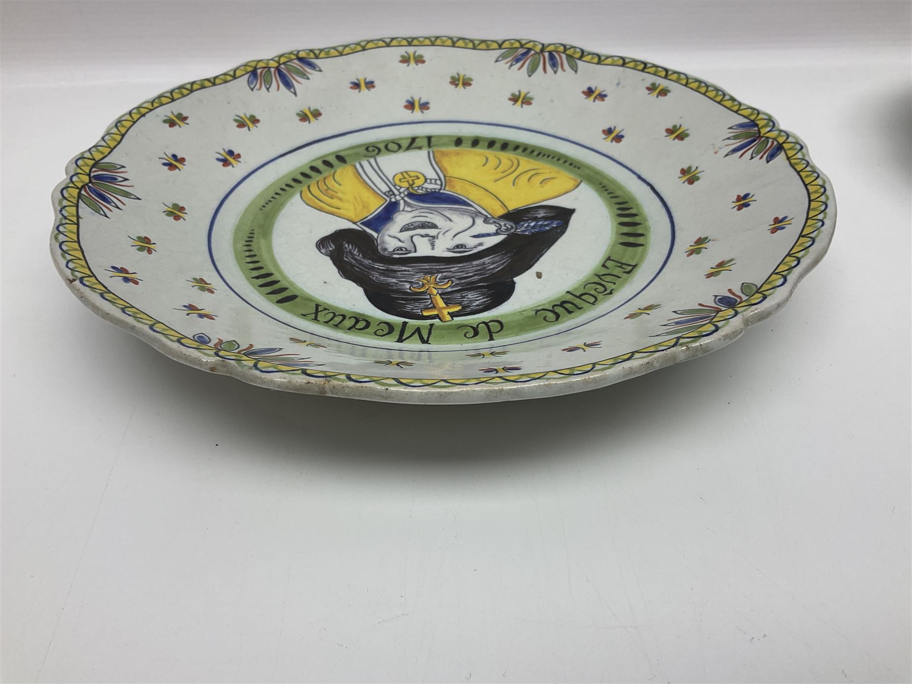 Four French Faience plates, comprising Je suis las de le porter, Le malheur nous reunit, Je desire y arriver and Eveque de Meaux, D24cm  
