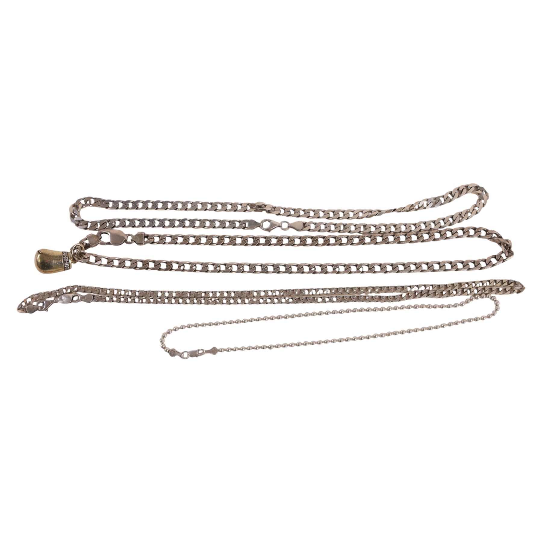 Silver chains and bracelets, including one with silver-gilt cubic zirconia boxing glove charm