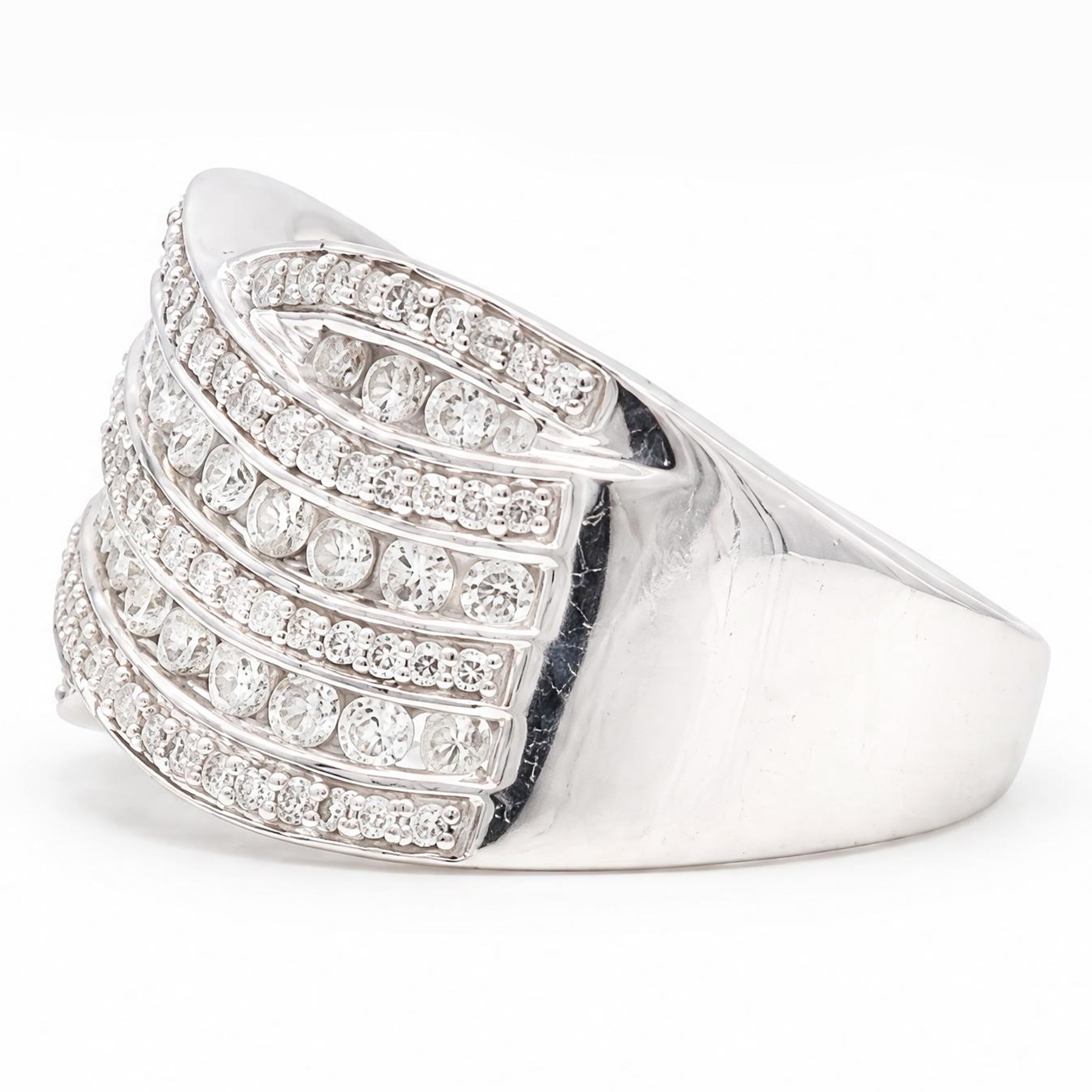 18ct white gold diamond wave design ring, channel and grain set with alternating rows of round brilliant cut diamonds, hallmarked, total diamond weight 1.00 carat