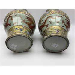 Pair of early 20th century Chinese vases decorated with dragons chasing a flaming pearl, with a gilt border of butterflies and floral sprigs, with Elephant head handles, H44cm 