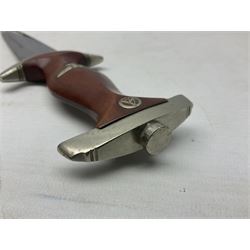 WW2 German SA dagger the 22cm double edged steel blade by G. Felix Gloriawerk Solingen inscribed 'Alles Fur Deutschland', the cross-piece impressed with the SA Gruppen mark Nm verso for Nordmark, wooden grip inset with eagle and SA emblem; in brown painted scabbard with nickel mounts L37cm overall