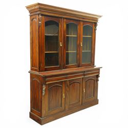 Victorian revival hardwood dresser cabinet, projecting moulded cornice above three glazed doors with shaped tops enclosing shelves, moulded top over three drawers and three panelled cupboard doors, flanked by applied carved brackets, on plinth base