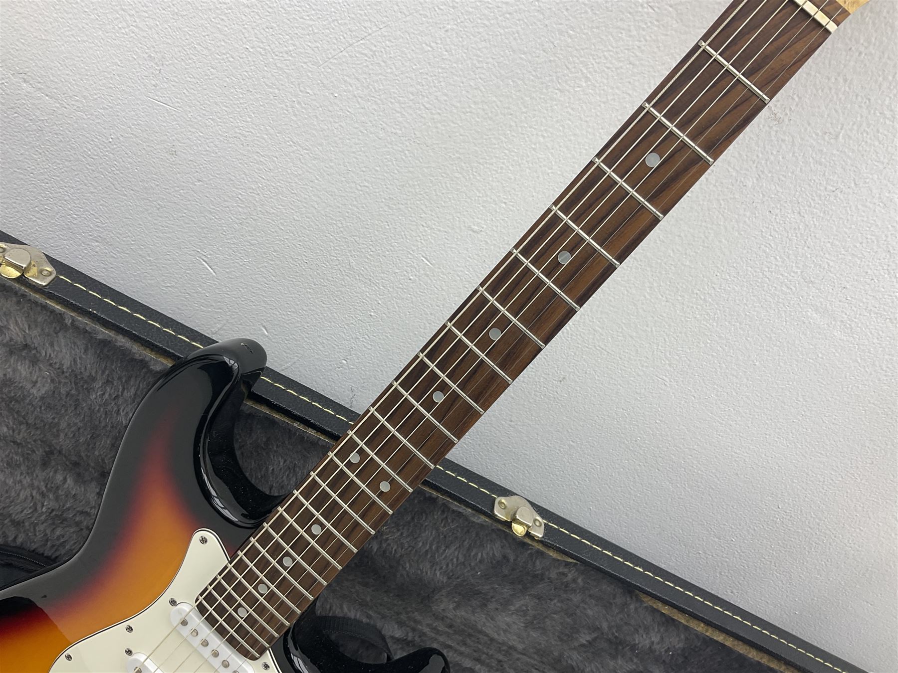 Fender style sunburst electric guitar with manuscript mark 'Zenta Stratocaster 1963' L97cm; in hard carrying case; another similar unmarked sunburst electric guitar; in gig bag; and Fender Frontman Amplifier, serial no.M473406 (3)