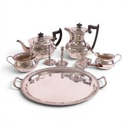 Four piece silver plated tea service, comprising teapot, hot water jug, milk jug and open sucrier, together with serving tray, toasted cheese dish, sugar tongs and pair of candle sticks 