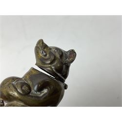 Victorian novelty brass vesta case modelled in the form of a pig holding a money bag, together with a silver vesta, hallmarked 