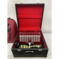 Hsinghai Studio piano accordion with red pearline finish, twenty keys and seventy-two buttons W44cm; in hard carrying case with additional The Music Room soft gig case