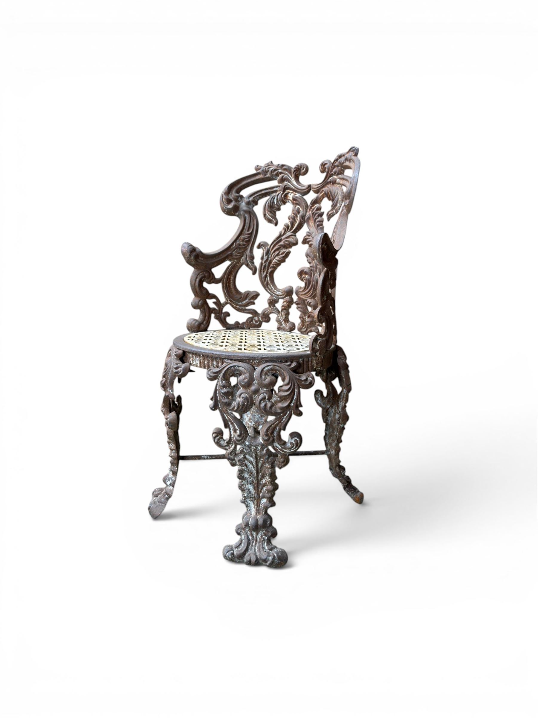 19th century Rococo Revival cast iron garden chair, pierced back comprised of scrolling acanthus leaves, over a pierced geometric white painted drop-in seat, raised on four acanthus and anthemion shaped cabriole supports united by X-frame stretcher