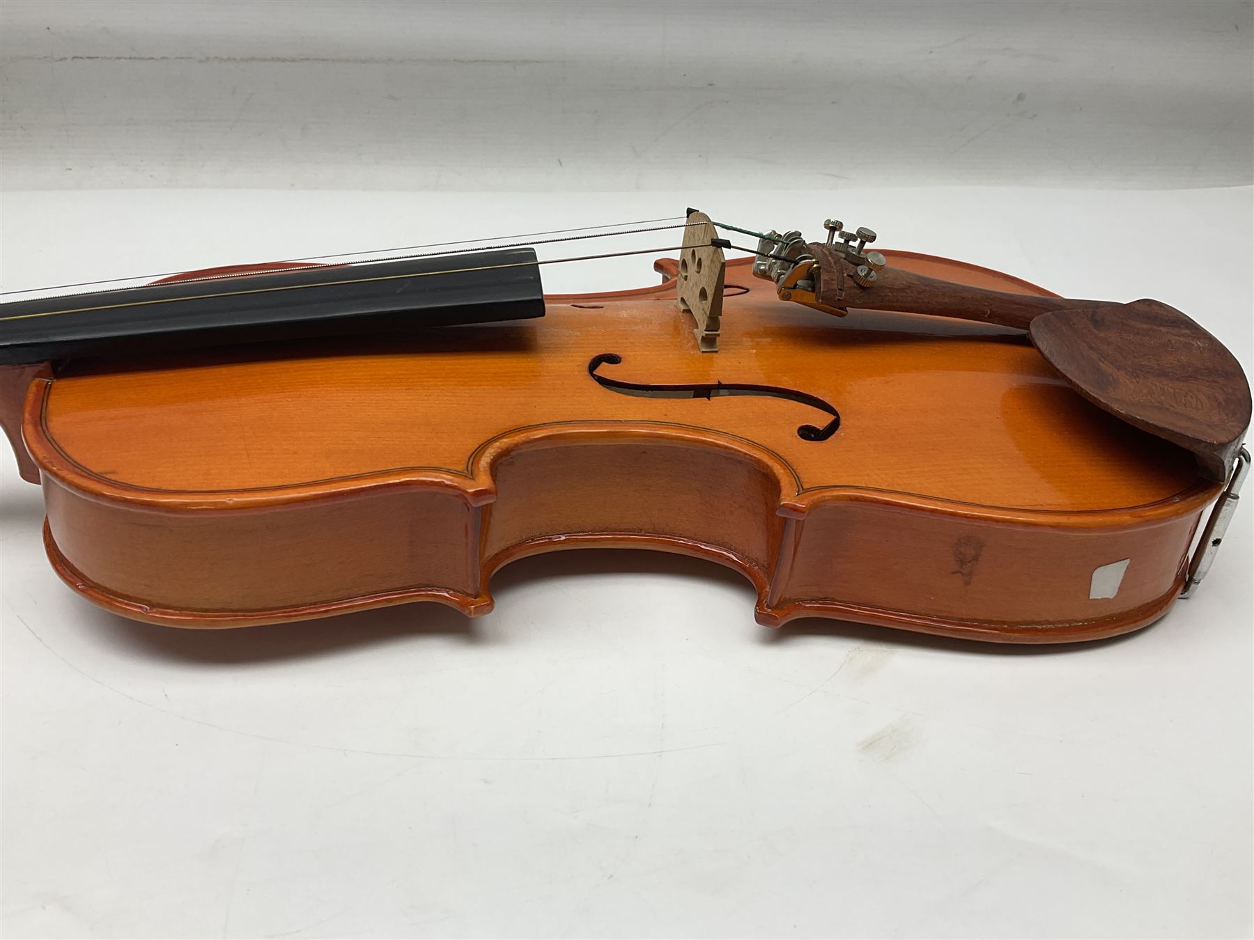Three Stentor Student violins - three-quarter size with 33cm two-piece back; and two quarter size each with 28cm two-piece back; each in carrying case with bow (3)